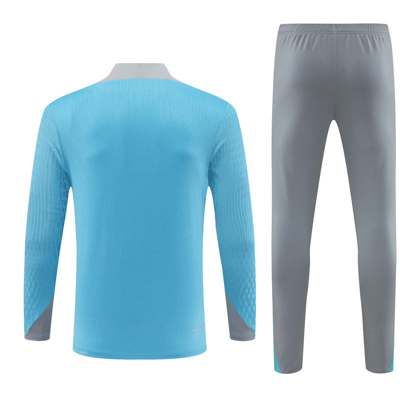 player version 24-25 ATM light blue with gray half zipper training tracksuit