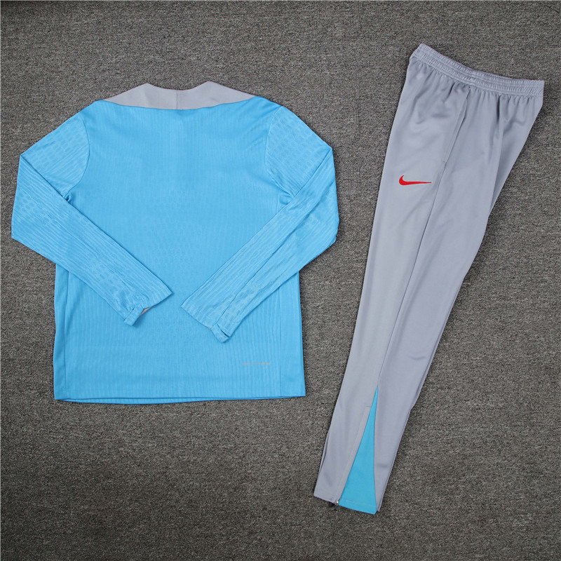 player version 24-25 ATM light blue with gray half zipper training tracksuit