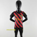 Manchester City away kids kit