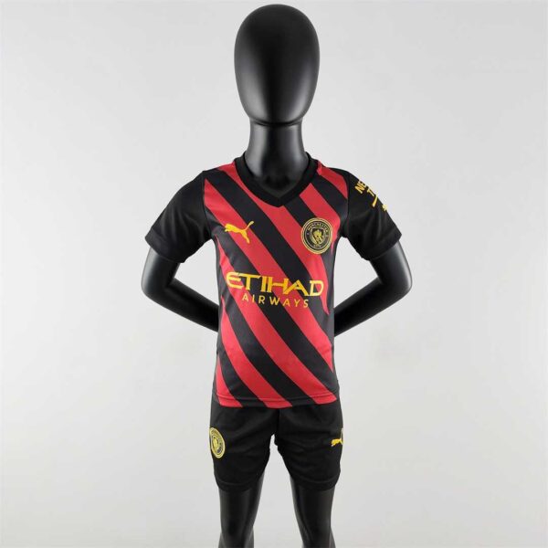 Manchester City away kids kit