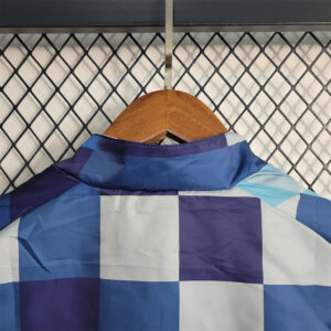 MCI blue with white and light blue Windbreaker