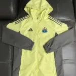 Newcastle football uniform yellow trench coat