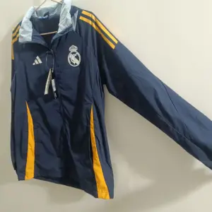 New Royal Madrid sapphire blue mid-length windbreaker